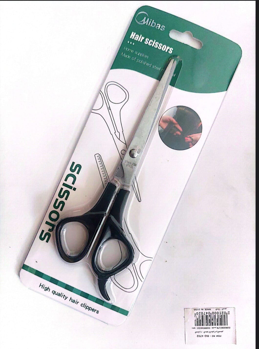 مقص حلاق يد سوداء